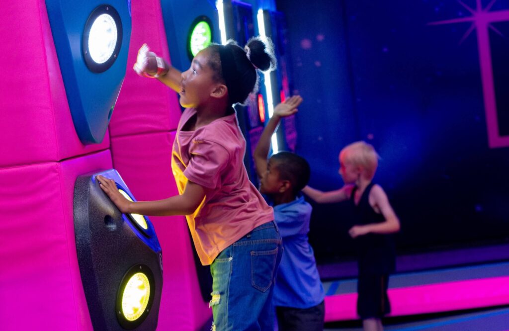 Child using reaction game at Freedom Adventure Park