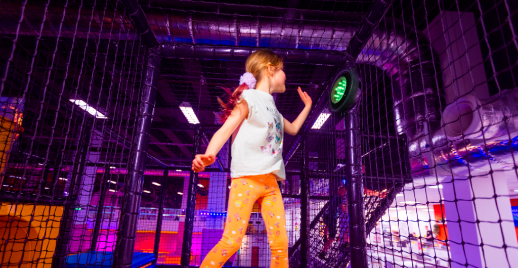 Girl hitting Freedom Gaming pod